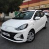 A Hyundai Grand i10 economy hatchback parked in Dubai, featuring a compact modern design, fuel-efficient petrol engine, and automatic transmission, ideal for affordable city car rental and daily driving in Dubai.